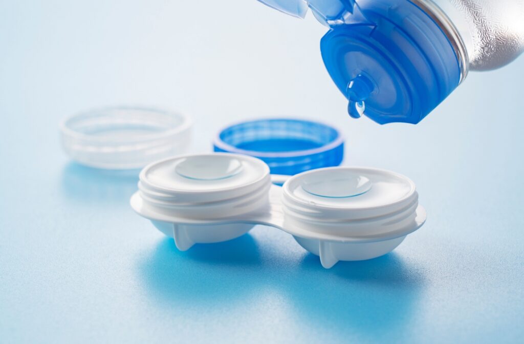 Contact lenses in a case with fresh solution being added.