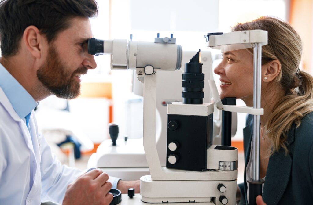 An optometrist assessing a patient's eyes during a comprehensive eye test.